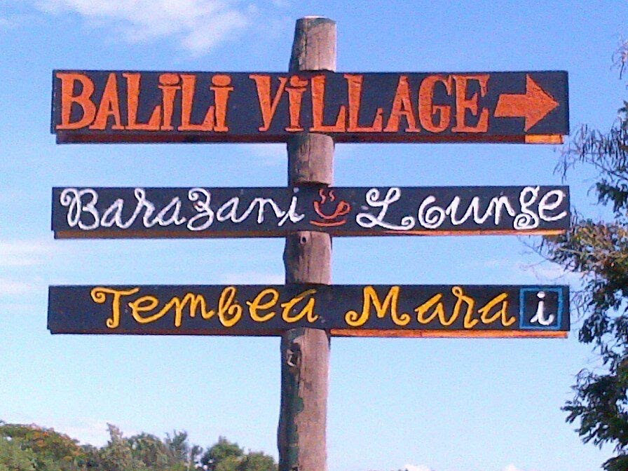 Hand-painted Tembea Mara sign
